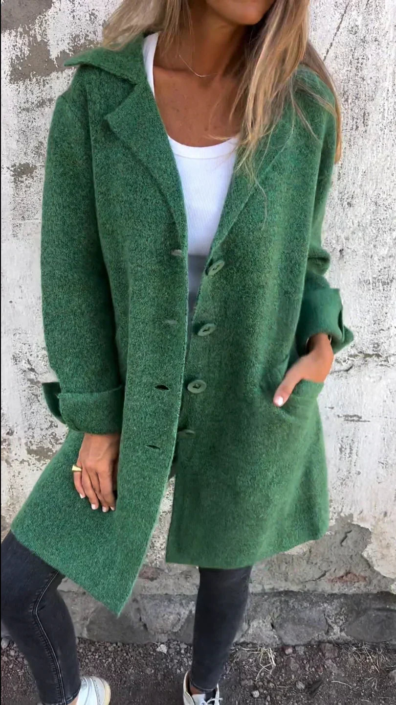 Women's long button-front coat with notched lapels and patch pockets