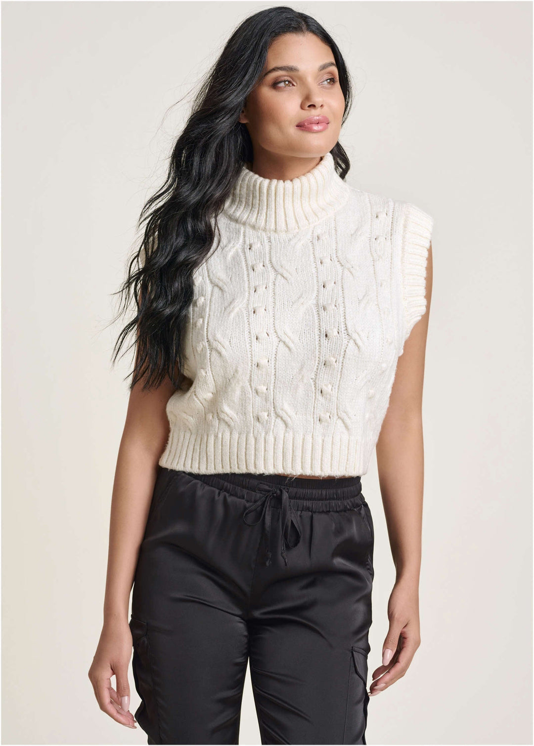 Women's cream cable knit sleeveless sweater vest with turtle neck