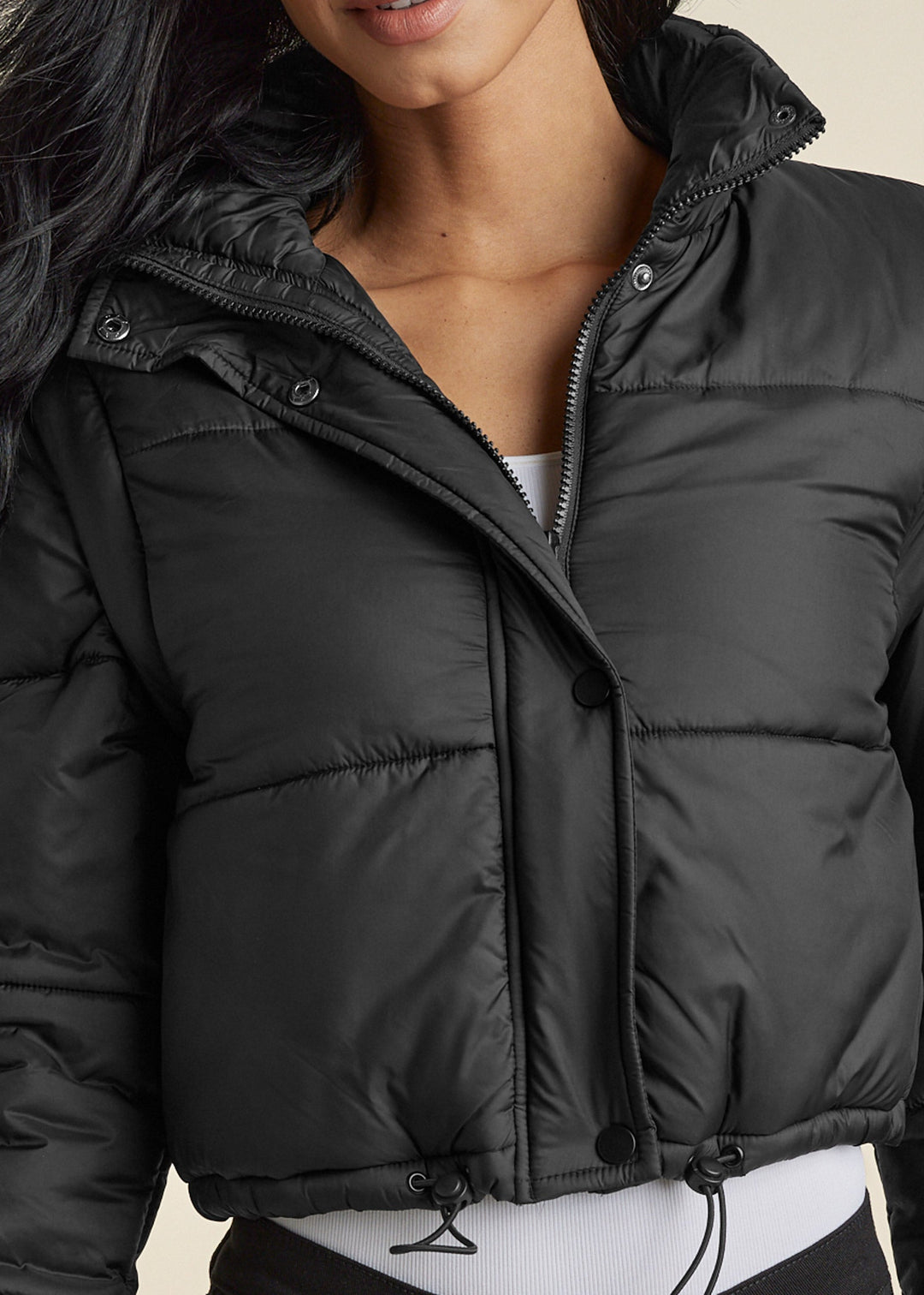 Women's black cropped quilted puffer jacket with hood and drawstring hem