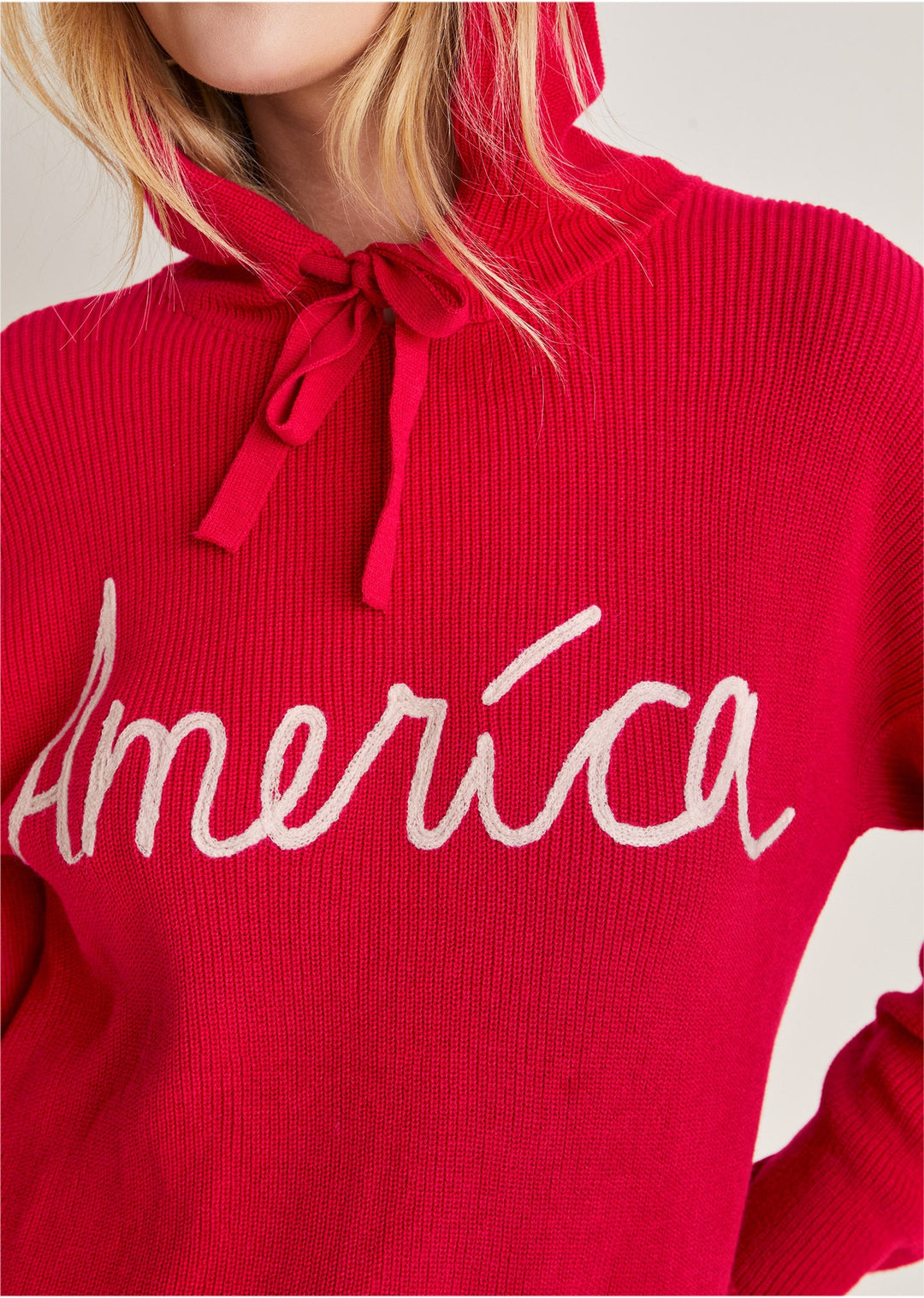Red women's hooded pullover with America text