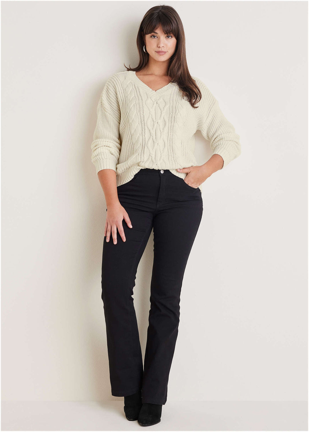 Women's cream cable knit V-neck sweater with long sleeves
