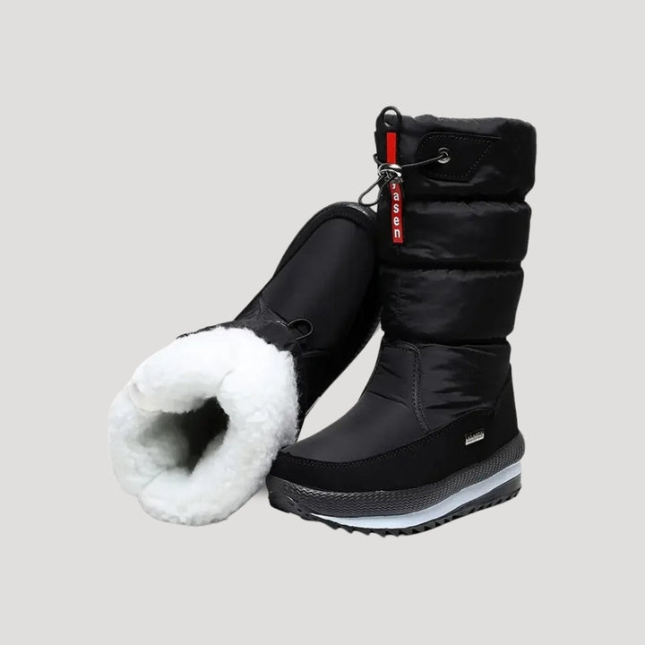 Women's black puffer winter boots with zipper and lugged soles