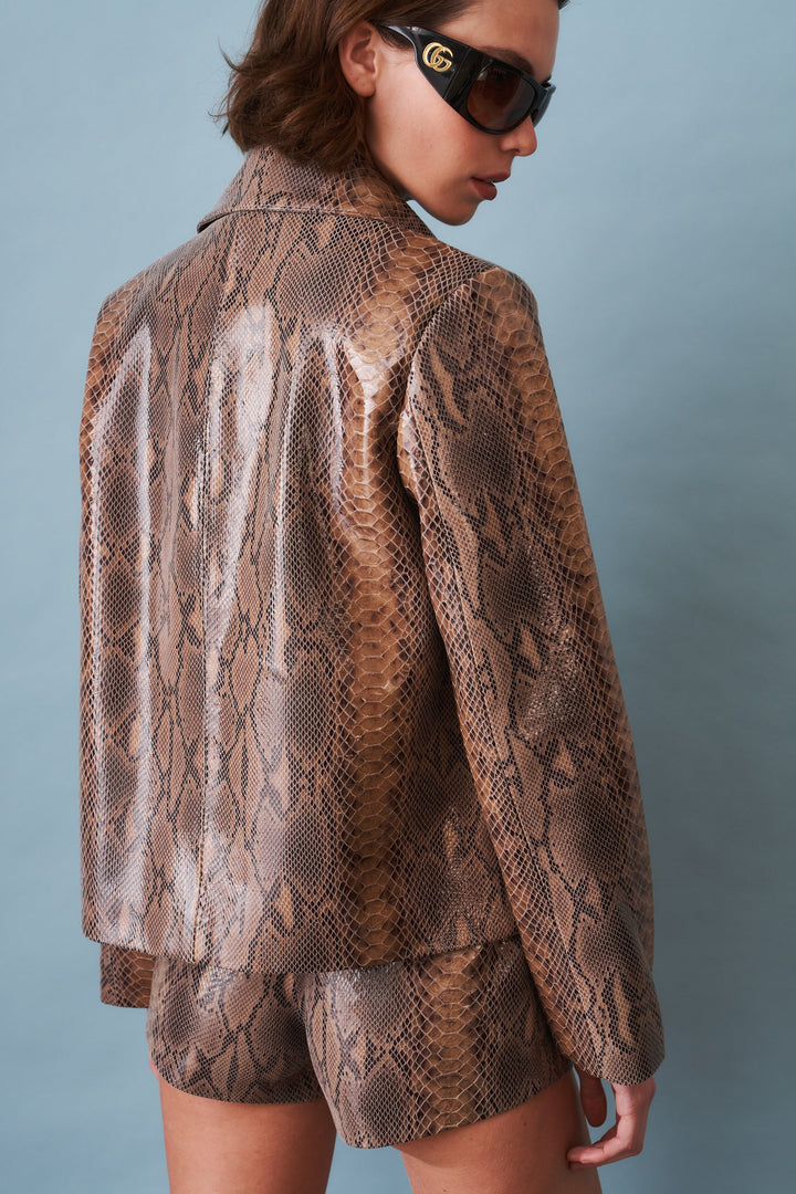 Women's brown snake print blouson jacket with pointed collar and front zip
