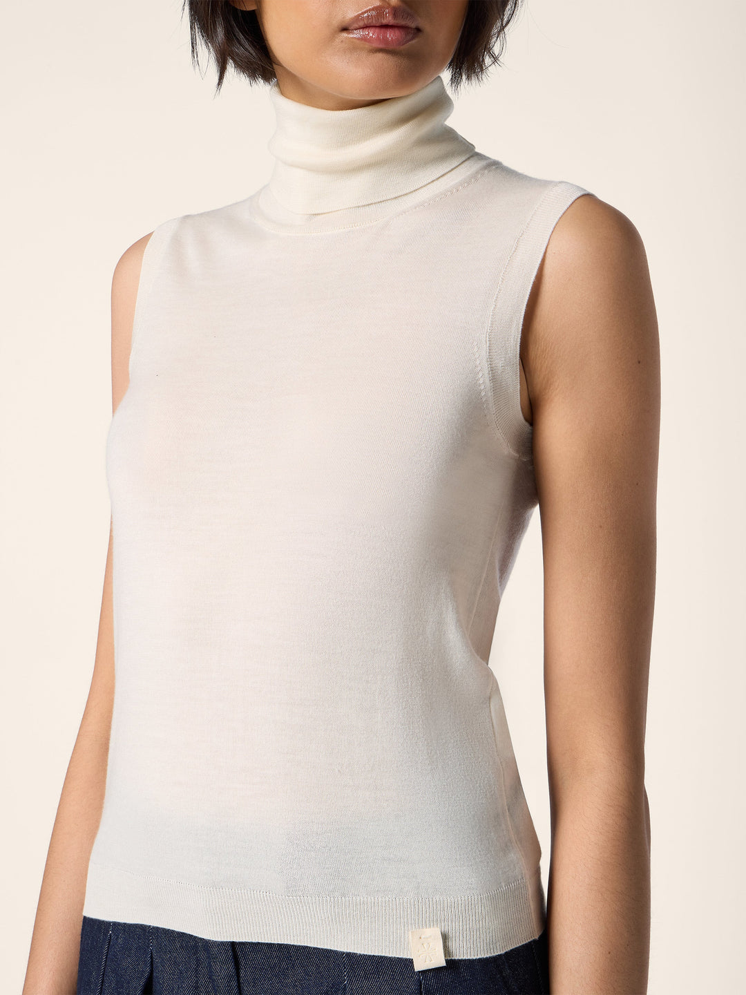 Women's cream sleeveless mock neck knit sweater