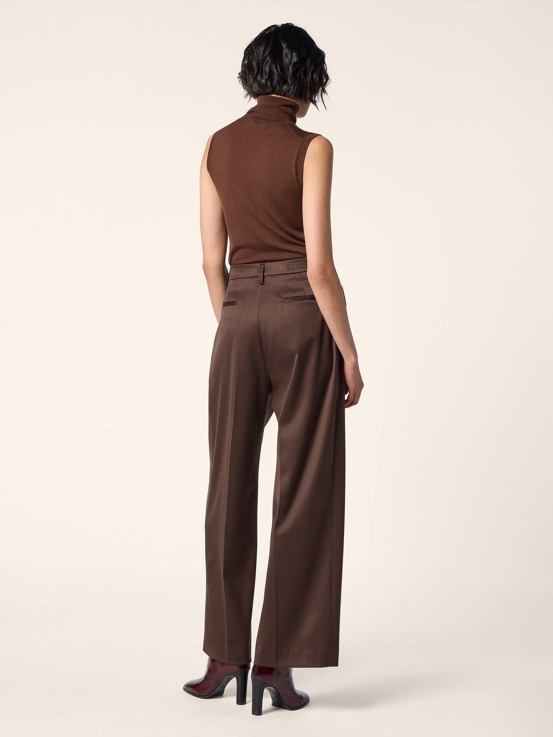 Women's brown sleeveless mock neck sweater with slim fit