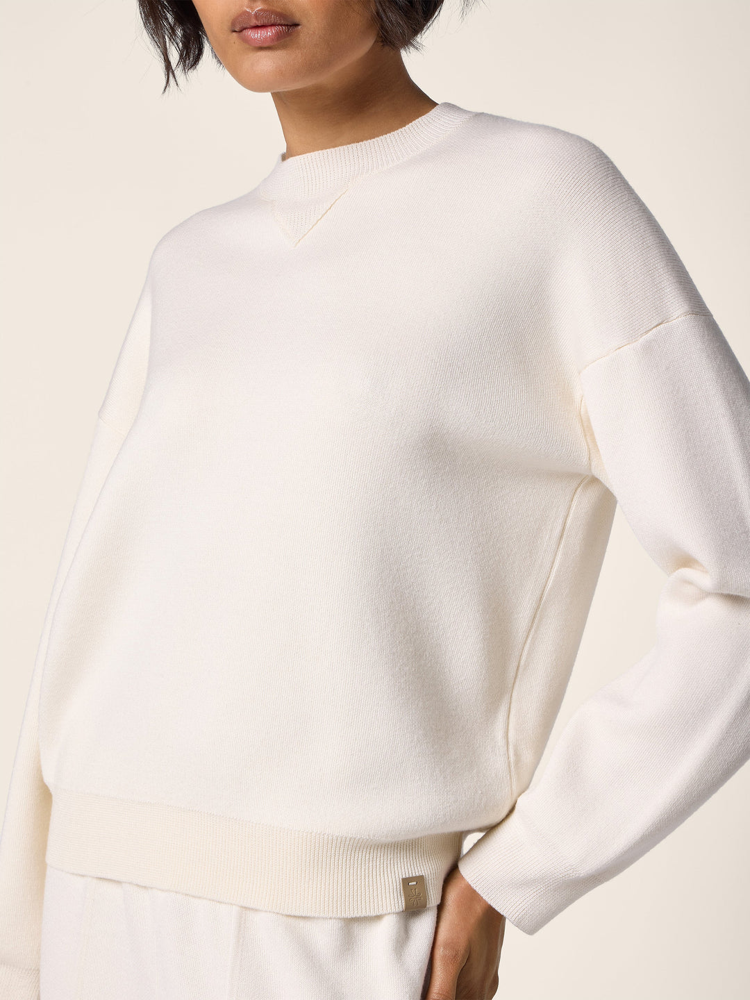 Women's cream crew neck jumper with long sleeves and ribbed trims