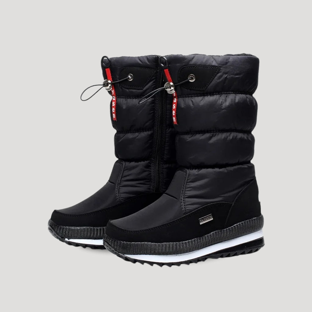 Women's black puffer winter boots with zipper and lugged soles