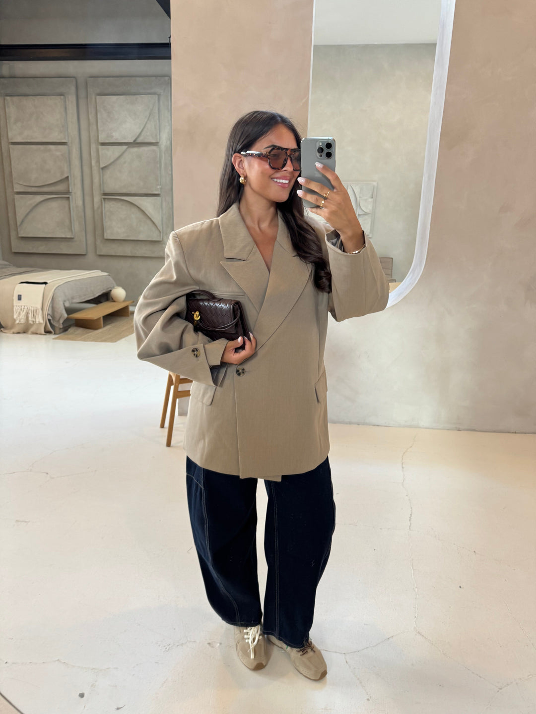 Women's beige blazer with notched lapels and button cuffs