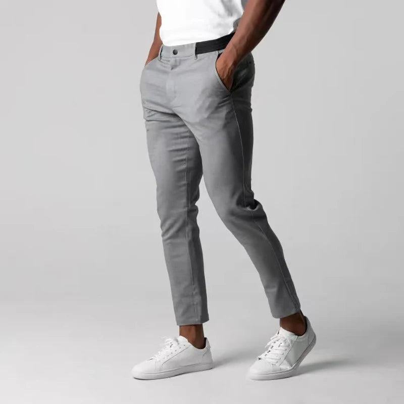 Men's slim tapered chino trousers with button fastening and ankle-length hems