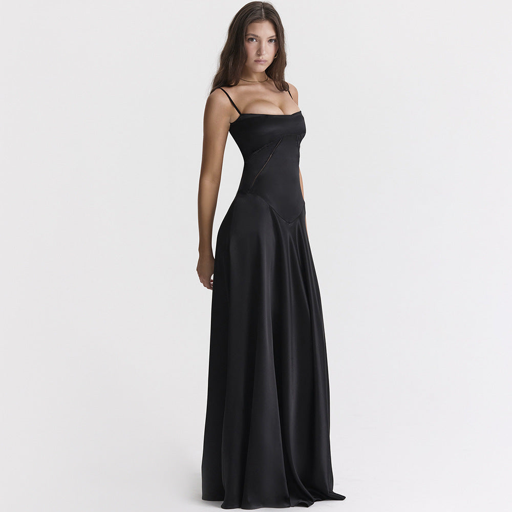 Women's black maxi dress with cowl neckline and cami straps, showing full-length floor skirt and back tie detail