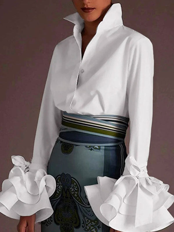 Women's solid blouse with raised collar, long sleeves, bow details and layered ruffle cuffs