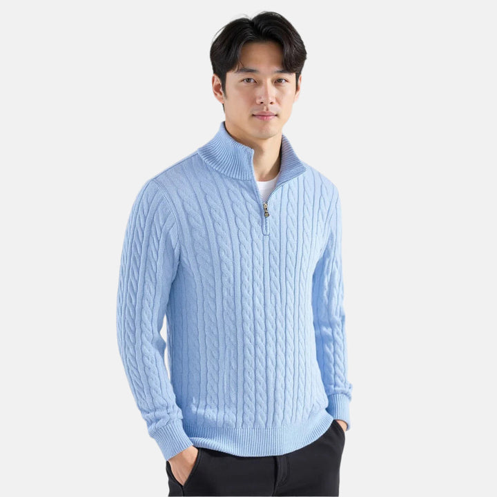 Men's blue cable knit quarter-zip sweater with mock neck and long sleeves