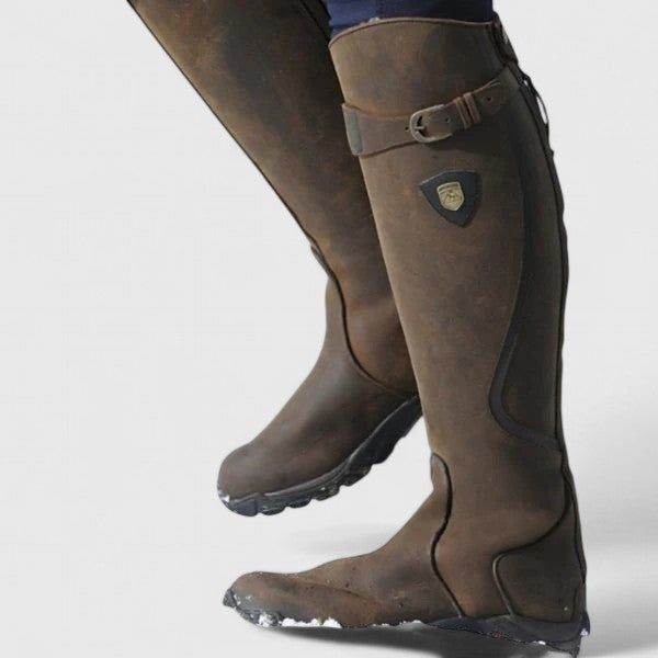 Women's cushioned orthopedic boots with adjustable buckle strap, suede-like upper, and grooved sole.