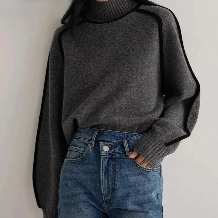 Women's turtleneck sweater with black contrast piping and long sleeves
