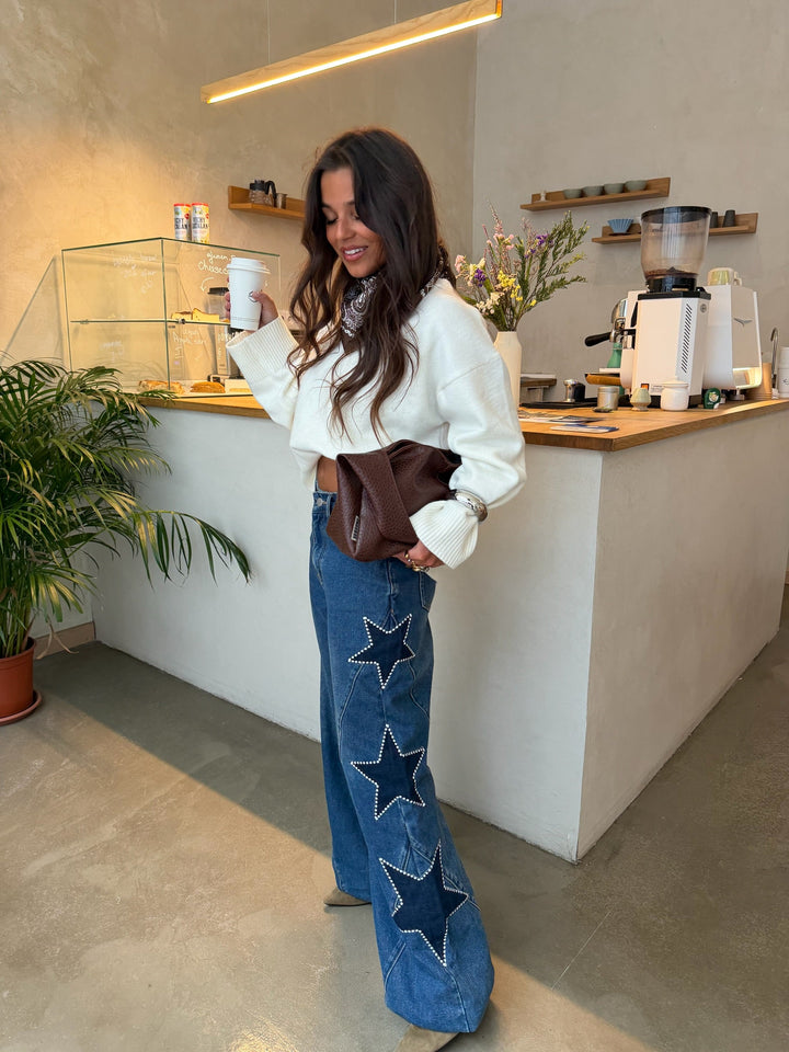 Women's blue wide leg jeans with star details