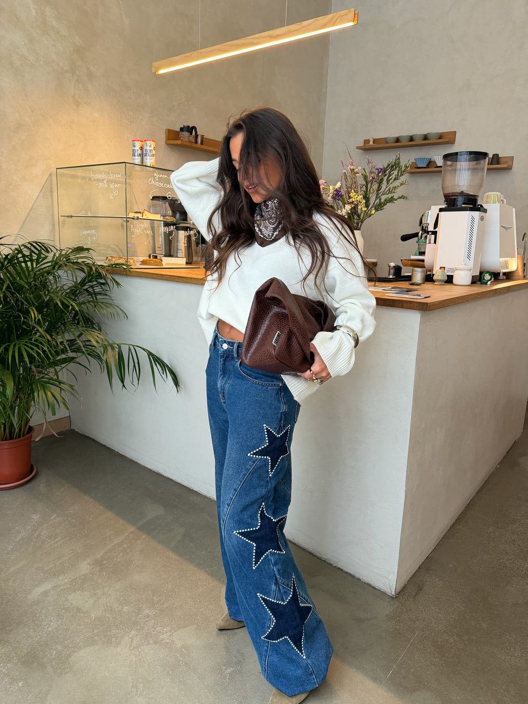 Women's blue wide leg jeans with star details