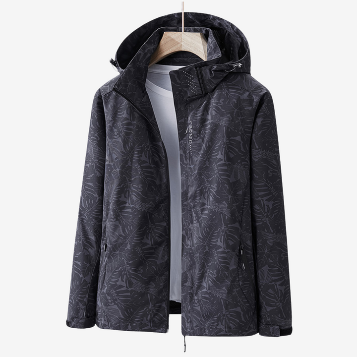Women's hooded leaf print windbreaker jacket with zipped pockets