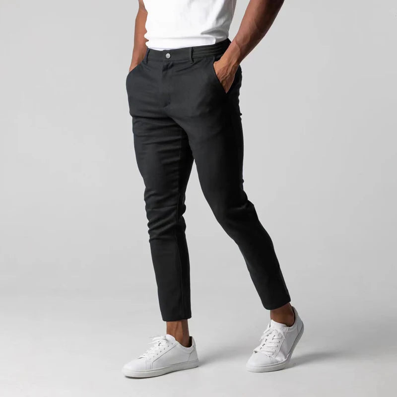 Men's slim tapered chino trousers with button fastening and ankle-length hems