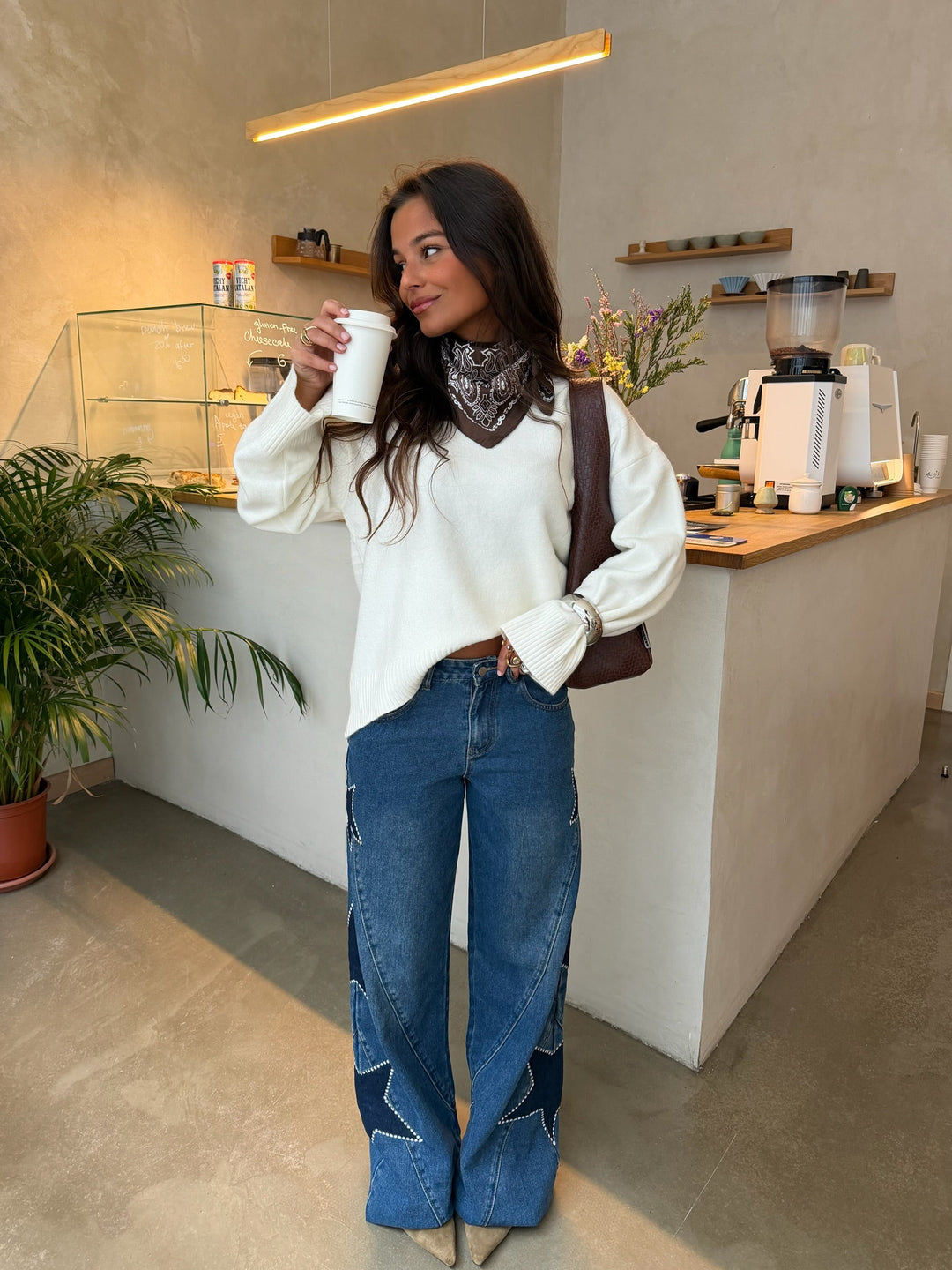 Women's blue wide leg jeans with star details