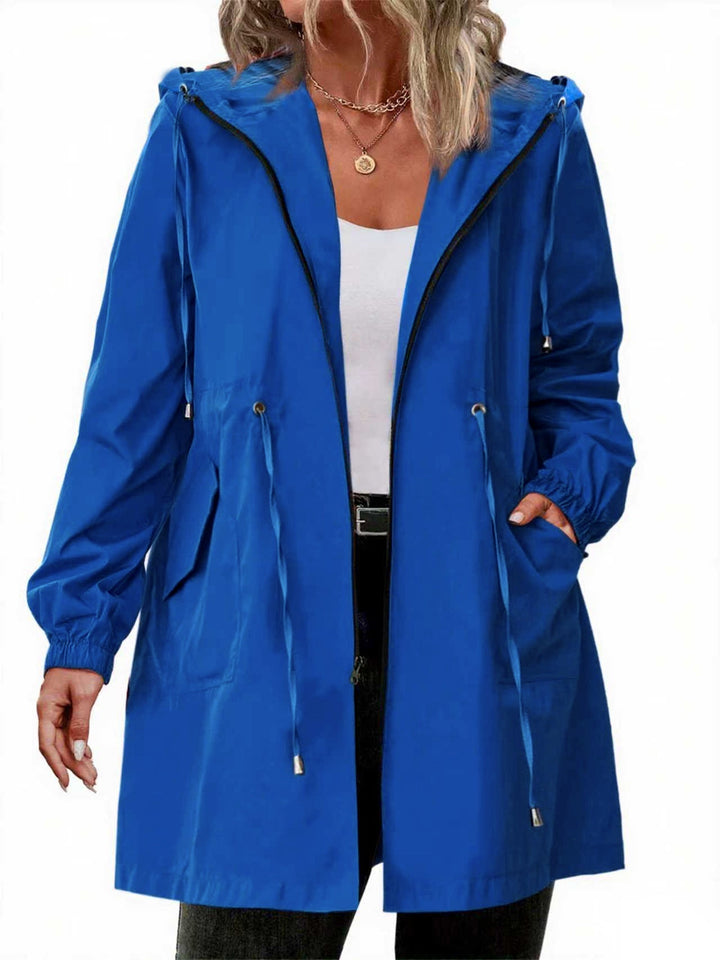Women's long hooded raincoat with zip front, drawstring waist and front pockets