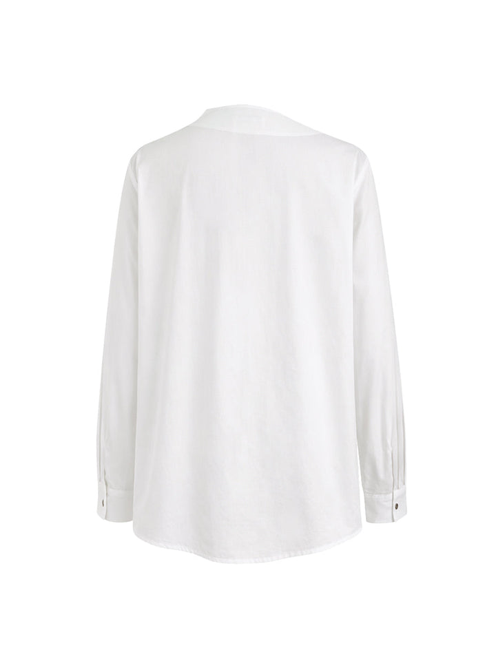Women's white asymmetric buttoned blouse with mandarin collar and long sleeves