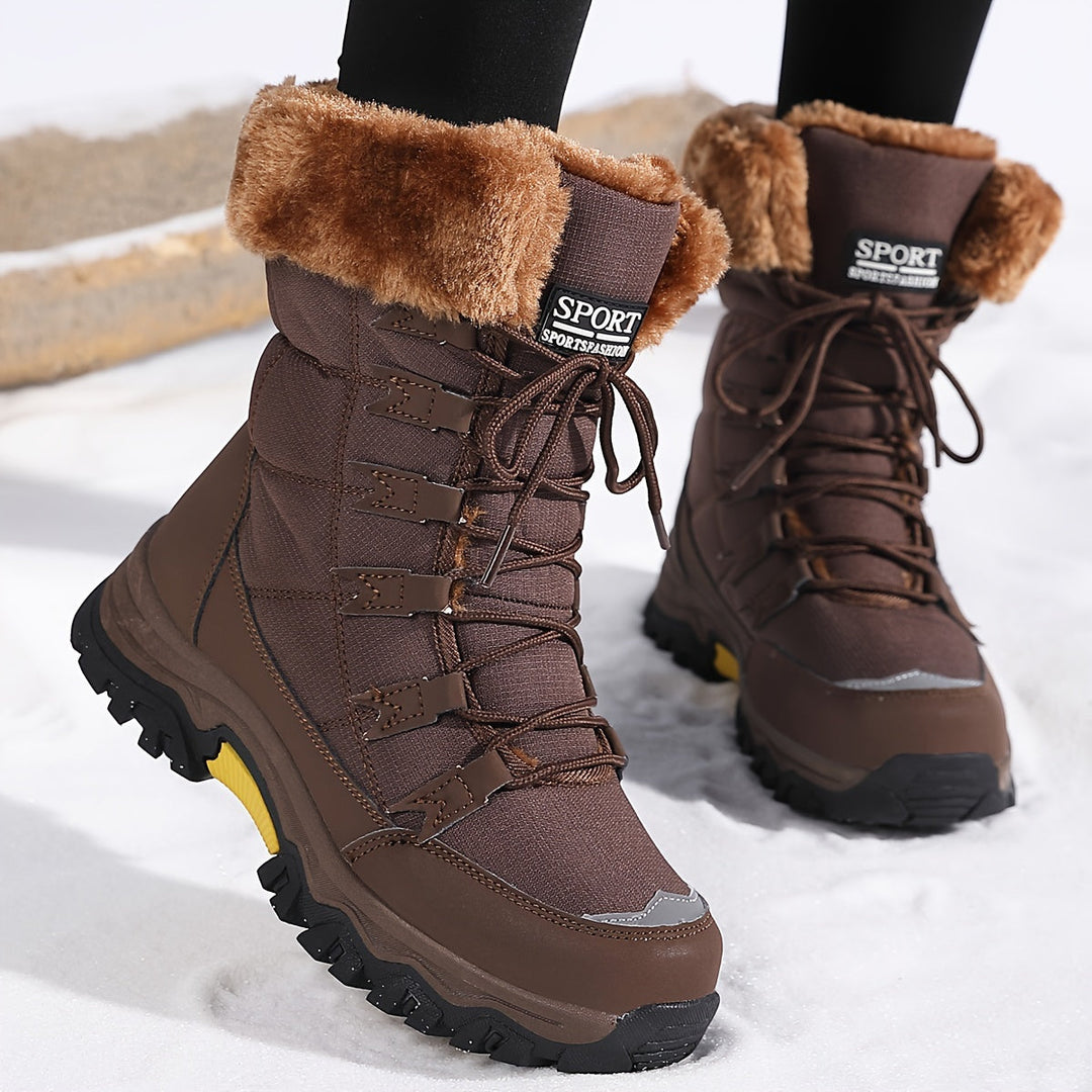 Women's lace-up winter boots with faux-fur cuffs and lug soles