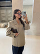 Women's beige blazer with notched lapels and button cuffs
