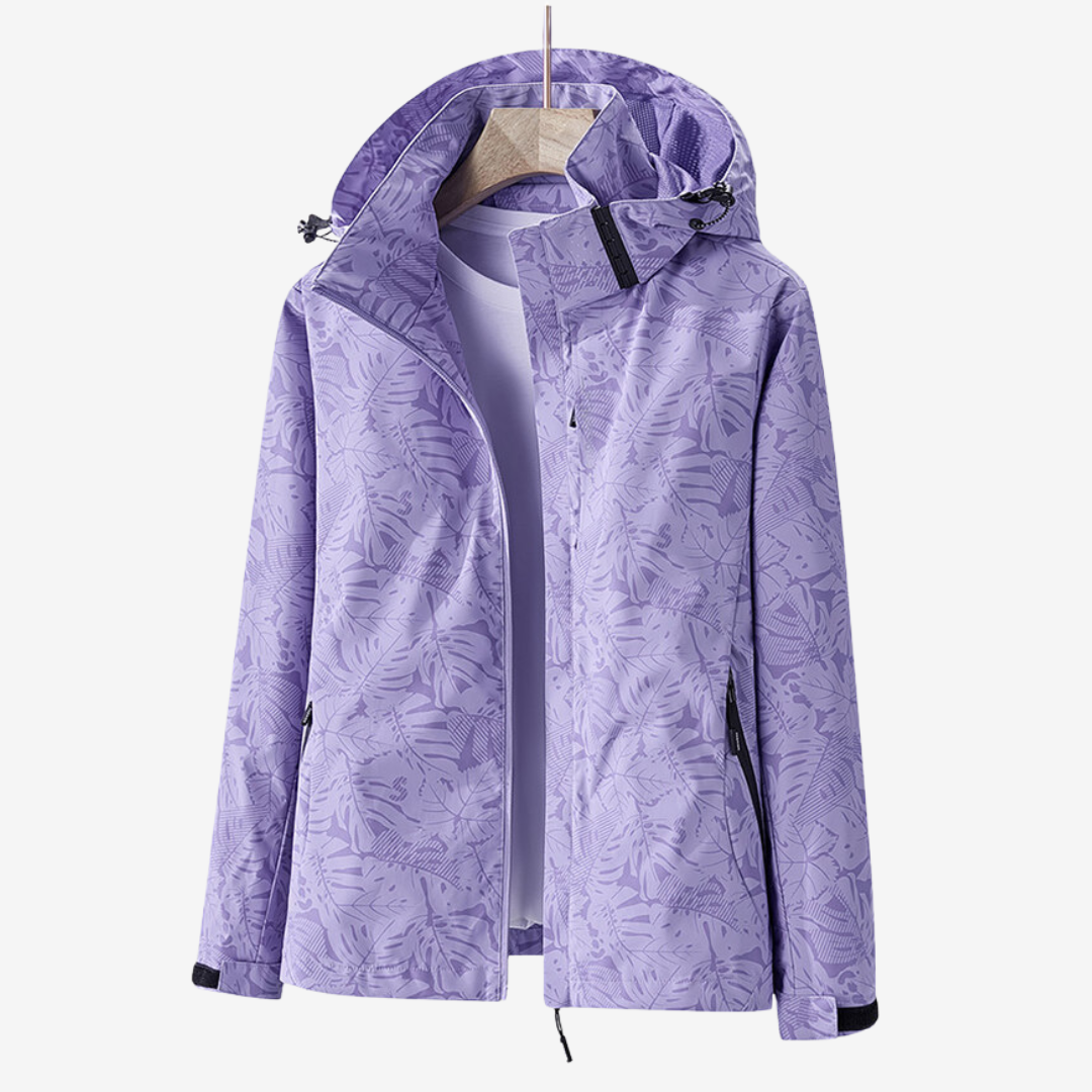 Women's hooded leaf print windbreaker jacket with zipped pockets