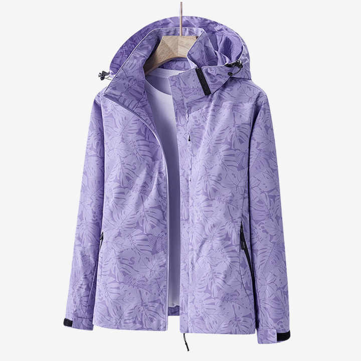 Women's hooded leaf print windbreaker jacket with zipped pockets