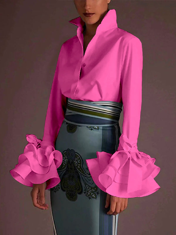Women's solid blouse with raised collar, long sleeves, bow details and layered ruffle cuffs