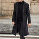 Men's long tailored coat with notched lapels and flap pockets