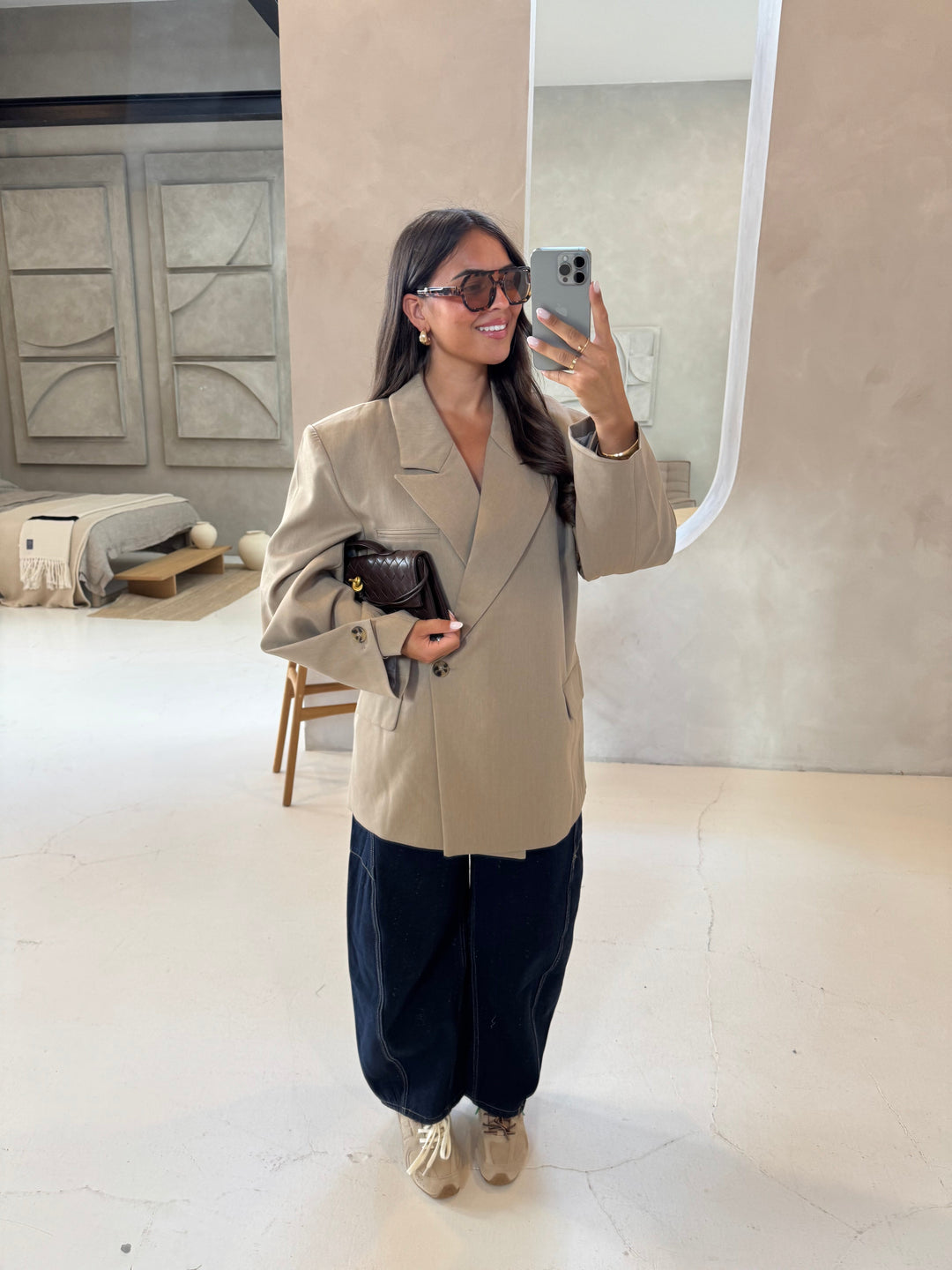 Women's beige blazer with notched lapels and button cuffs