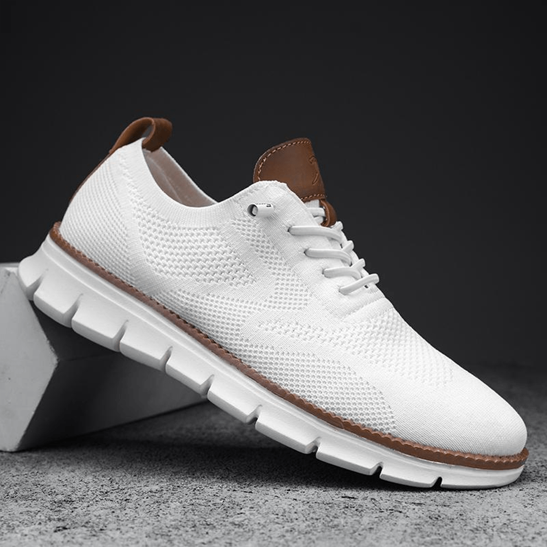 Unisex lace-up sneakers with textured panels and a white segmented sole