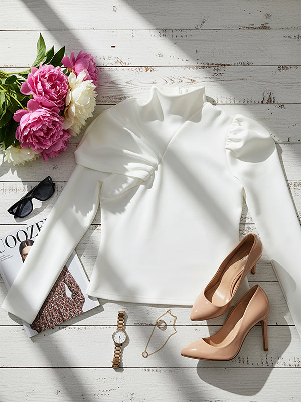 White women's high-neck long-sleeve top with asymmetric pleated shoulder detail