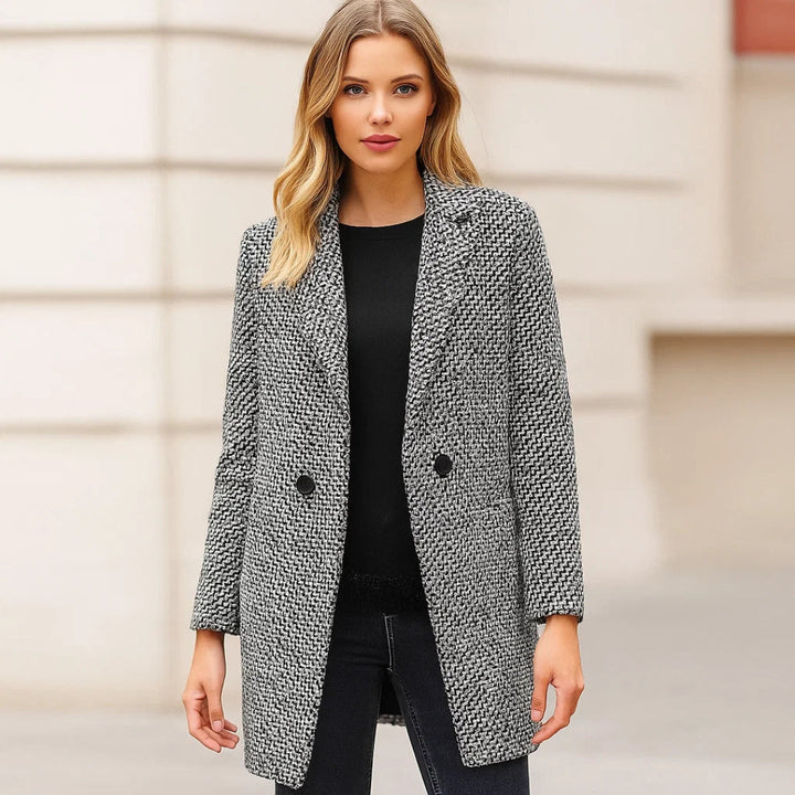 Women's black and white checked long coat with standing collar and button fastening