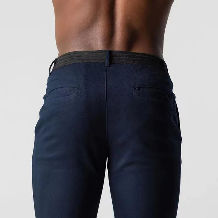 Men's slim tapered chino trousers with button fastening and ankle-length hems