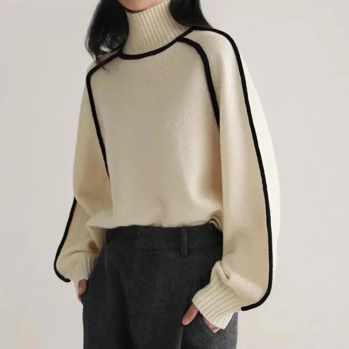 Women's turtleneck sweater with black contrast piping and long sleeves