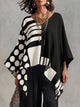 Women's oversized batwing sleeve top with polka-dot print in black and white, and green and white versions