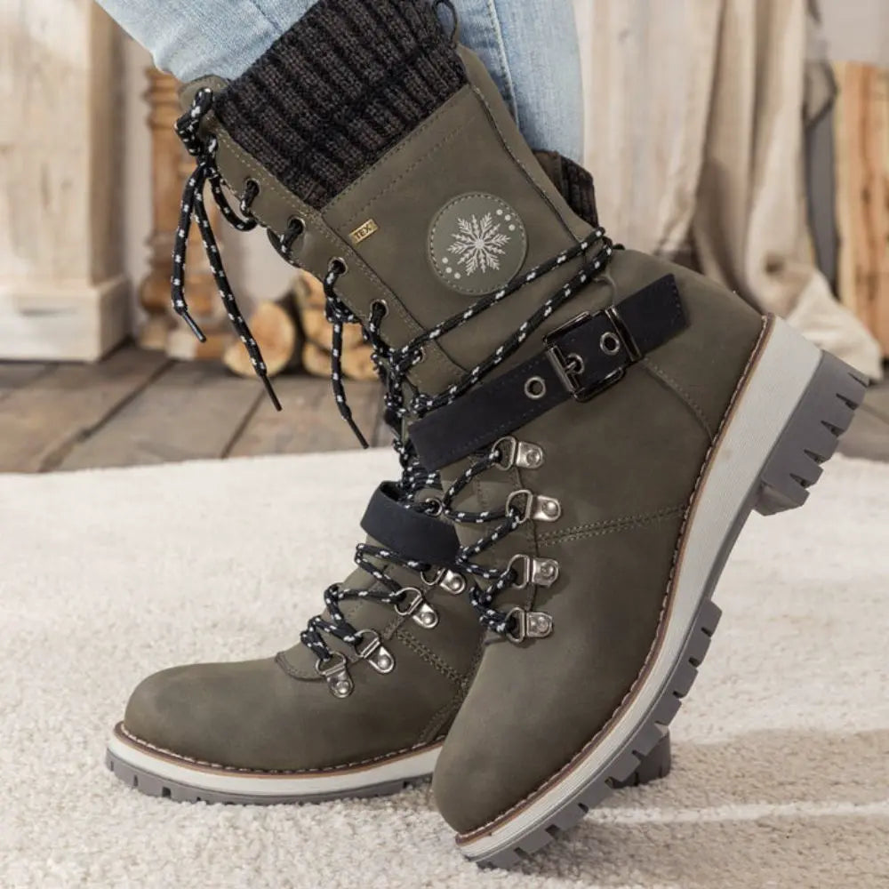Women's lace-up snow boots with buckle straps and treaded soles