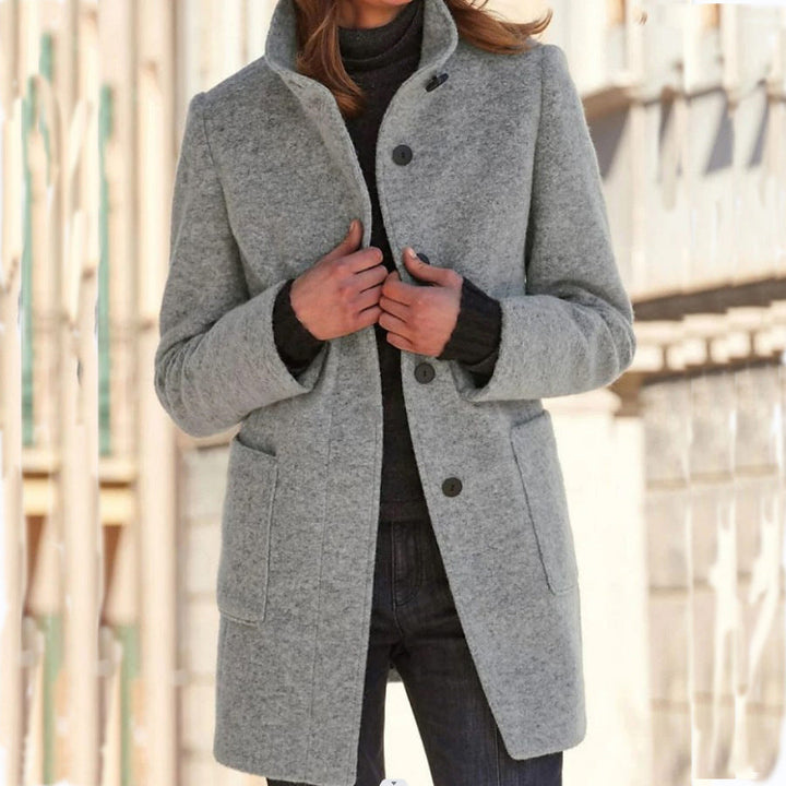 Women's long button-front coat with stand collar and patch pockets