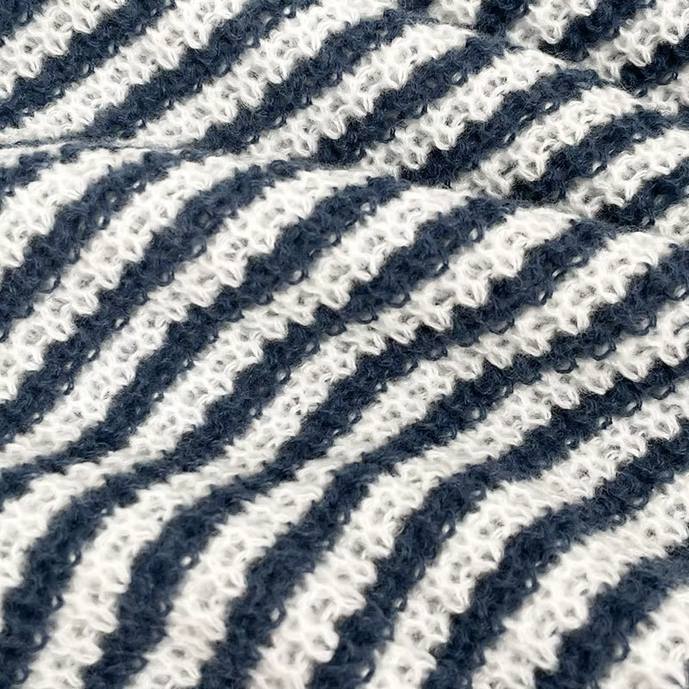Women's striped knit sweater with boat neckline and long sleeves