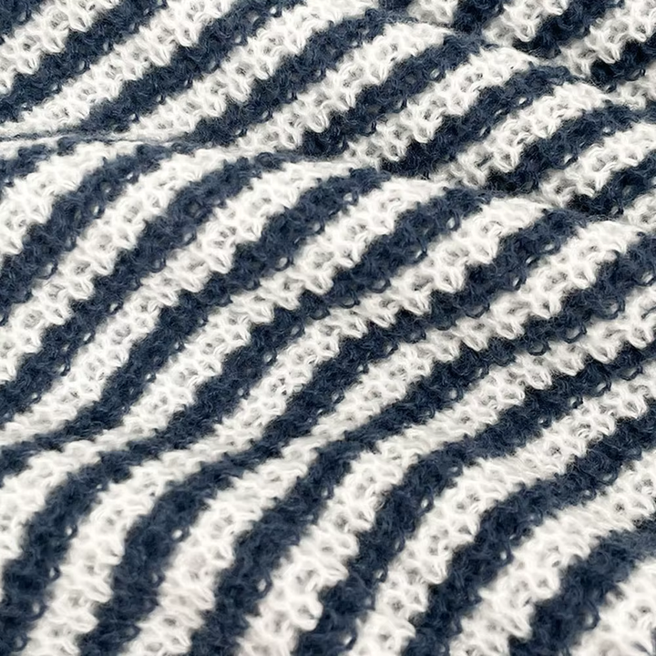 Women's striped knit sweater with boat neckline and long sleeves