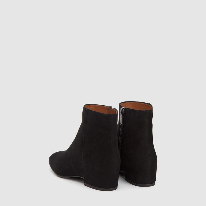 Women's black suede ankle boots with round toes, low heels and side zips