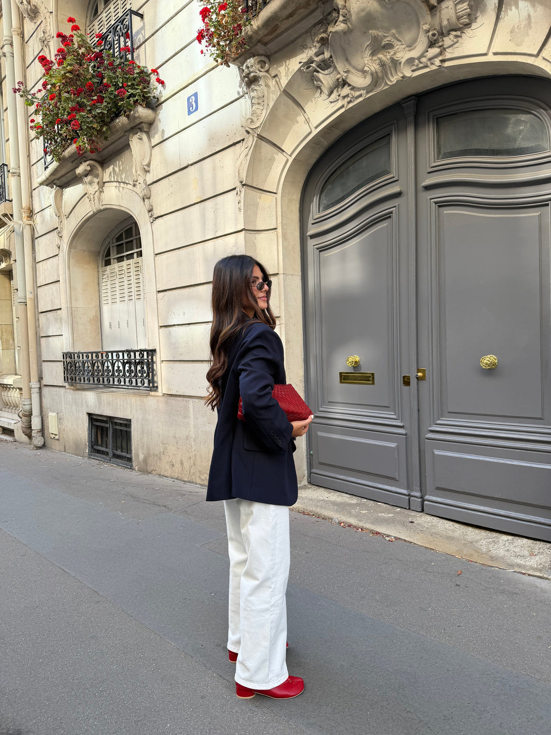 Women's navy blazer with notched lapels, long sleeves and button front