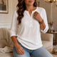 Women's waffle-textured Henley top with button placket and three-quarter sleeves