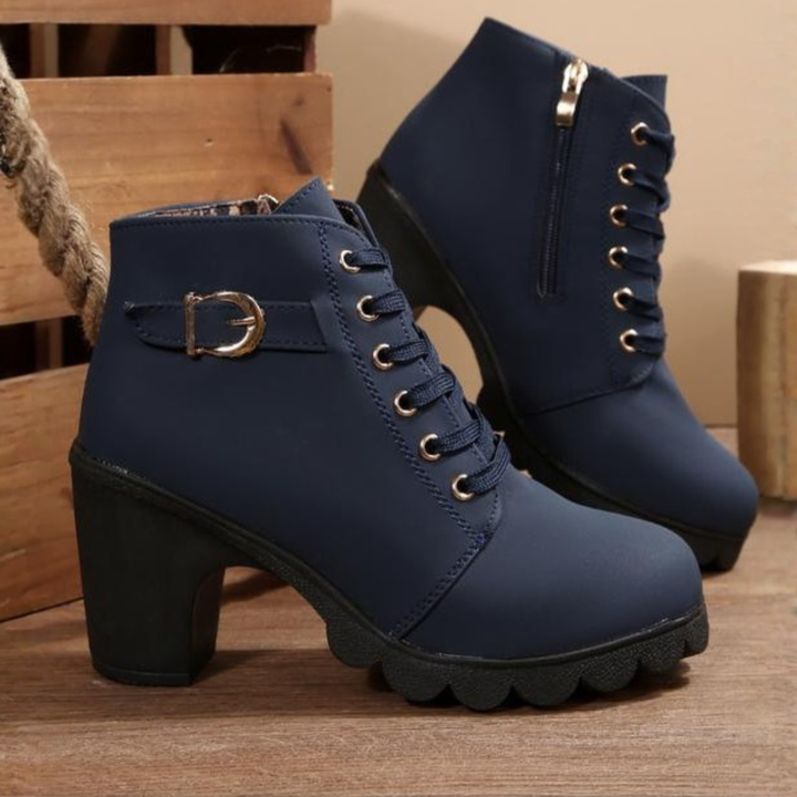 Women's black lace-up ankle boots with metal buckle strap and chunky block heel on platform sole
