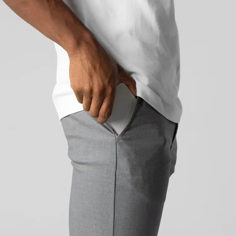 Men's slim tapered chino trousers with button fastening and ankle-length hems