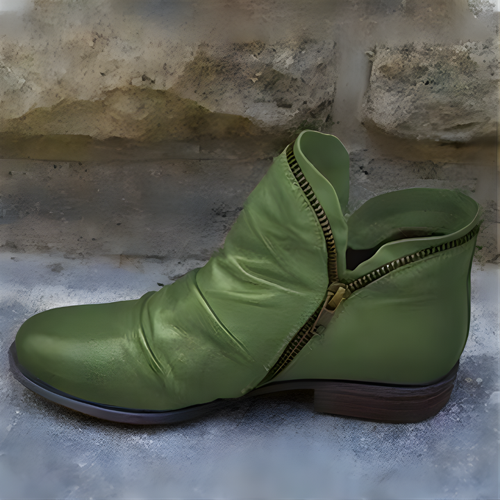 Purple ankle boot with ruched upper, side zipper and low heel