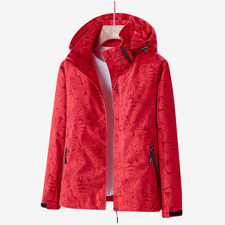 Women's hooded leaf print windbreaker jacket with zipped pockets