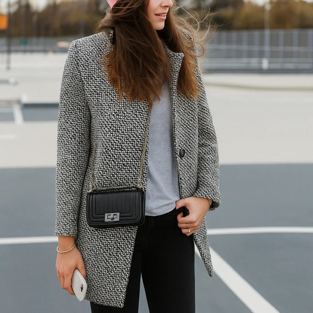 Women's black and white checked long coat with standing collar and button fastening
